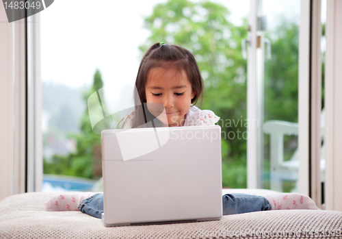 Image of Cute Child Using Laptop Computer