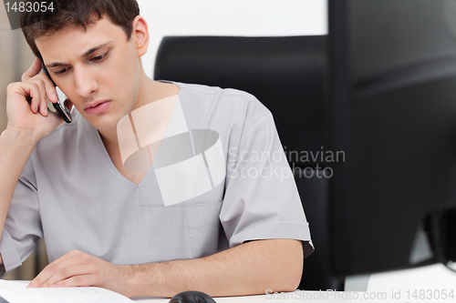 Image of Dentist talking on phone