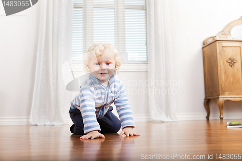 Image of Child Crawling on Floor