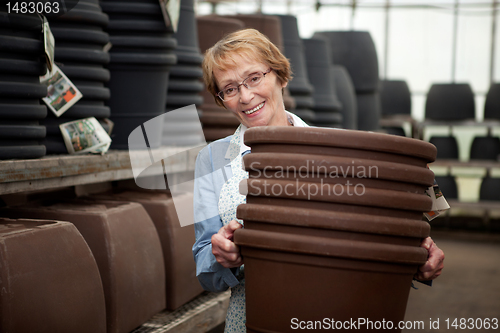 Image of Senior With Plant Pots