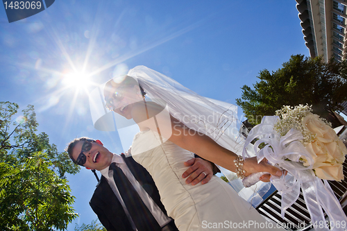 Image of Happily married couple in sunglasses
