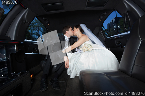 Image of Wedding Couple Kissing Each Other