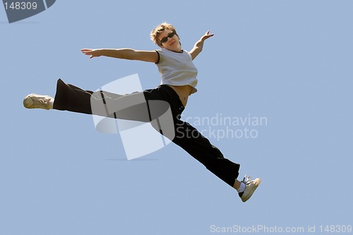 Image of Young woman jumping high