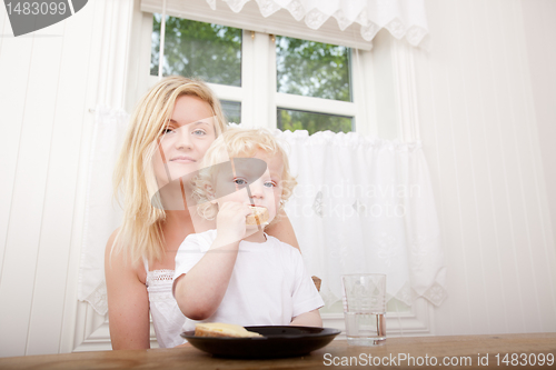 Image of Mother and Son Eating Meal