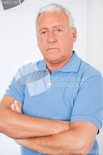 Image of Serious Senior Man With Arms Crossed