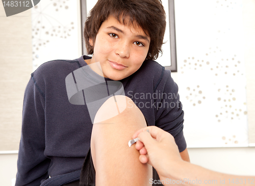 Image of Young Male Receiving Shonishin Acupuncture