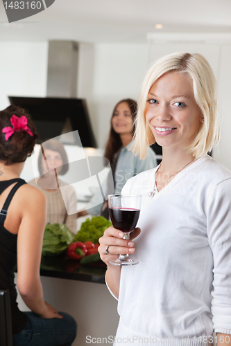 Image of Woman With Glass at Party