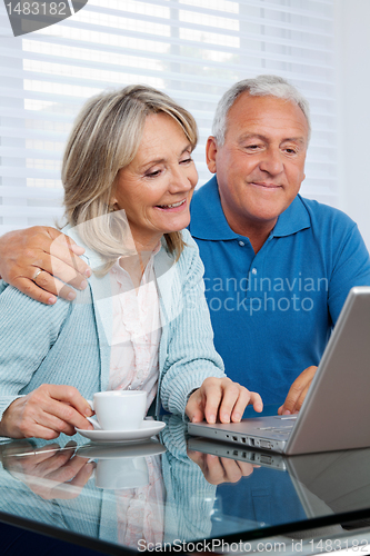 Image of Couple Using Laptop