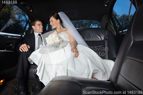 Image of Bride and Groom in Limo