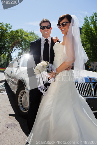 Image of Newly wed couple in sunglasses