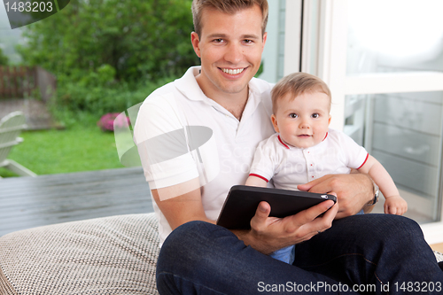 Image of Father and Son with Digital Tablet