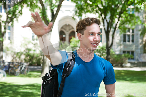 Image of Smiling University Student Waving