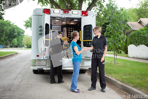 Image of Elderly Woman with Ambulance Staff