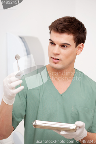 Image of Dentist Inspecting Mirror