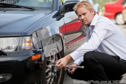 Image of Business Man Tire Change