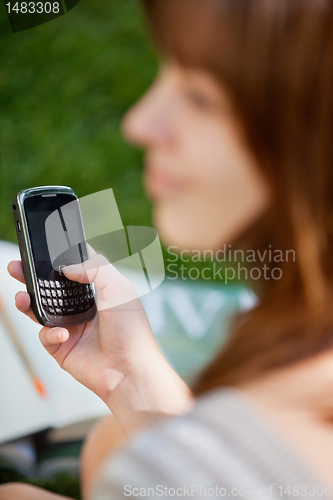 Image of Girl using cell phone