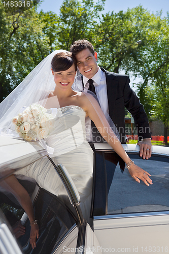 Image of Wedding Couple Portrait with Limo