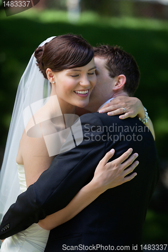 Image of Groom Kisses His Bride