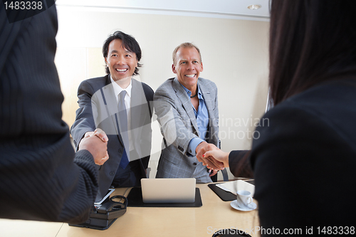 Image of Business people shaking hands