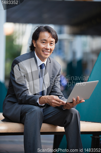 Image of Businessman using laptop