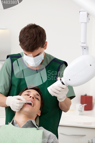 Image of Dentist Preparing X-ray