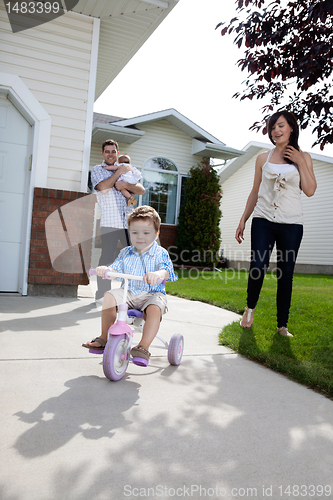 Image of Little Boy Learning Tricycle