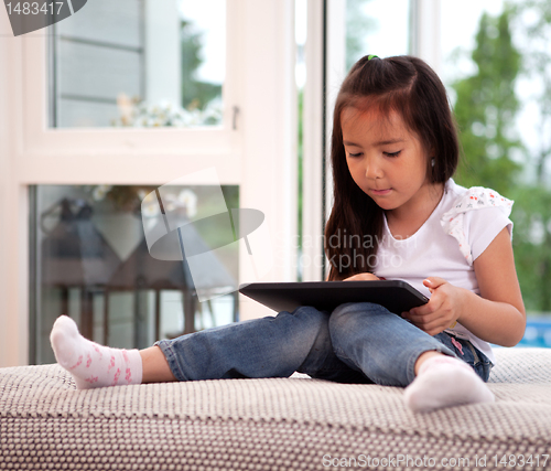 Image of Child Using Digital Tablet