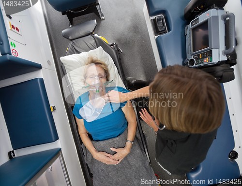 Image of Ambulance Interior with Senior Patient and EMT