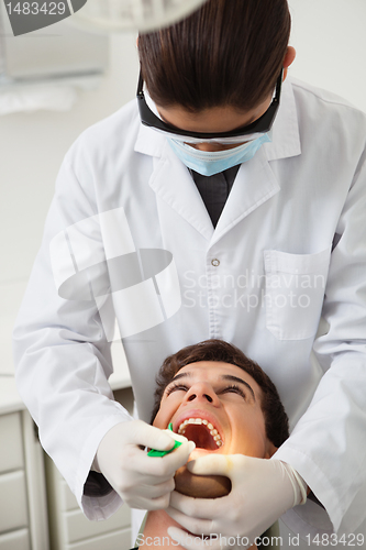 Image of Patient having his teeth examined