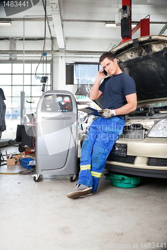 Image of Mechanic Talking on Phone