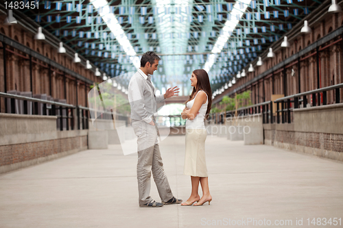 Image of Handsome Man Talking To Beautiful Woman