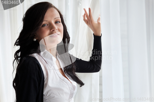 Image of Young Beautiful Business Woman Near Window