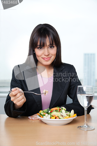 Image of Female Executive Eating Fresh Vegetable Salad