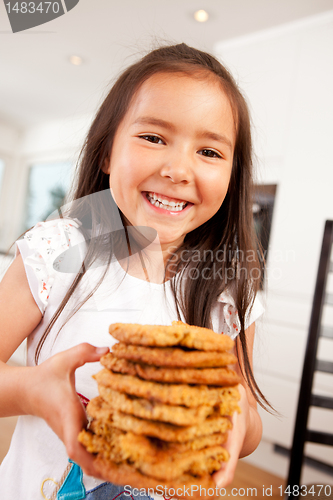 Image of Happy Cute Girl Holding Cookies
