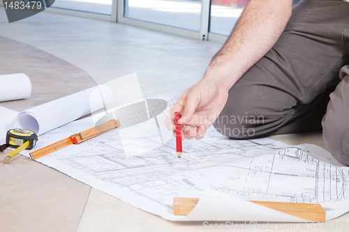 Image of Man holding pencil