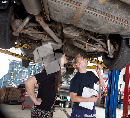 Image of Mechanic Showing Customer Repairs