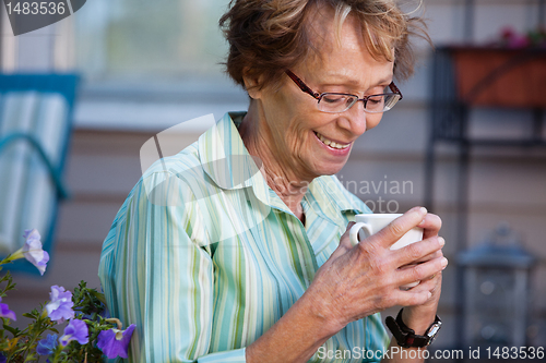 Image of Senior Woman with Warm Drink Outdoors