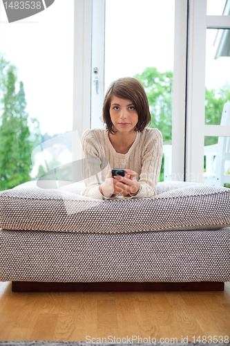 Image of Female holding cell phone