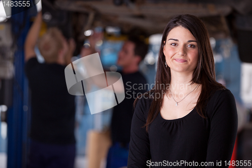 Image of Happy Woman Auto Repair Customer