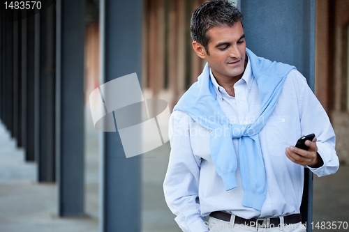 Image of Casual Man Using Cell Phone