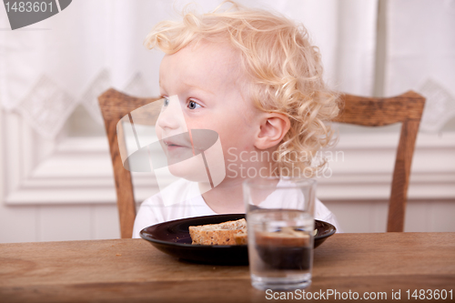 Image of Young Boy Eating Lunch