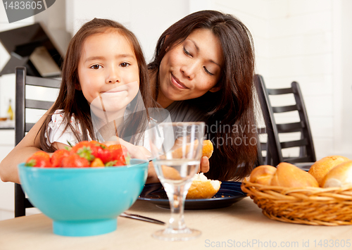 Image of Mother Daughter Eating Meal with Strawberries