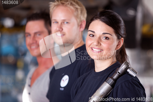 Image of Mechanic Team with Woman
