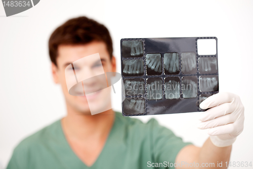 Image of Dentist Holding X-Ray