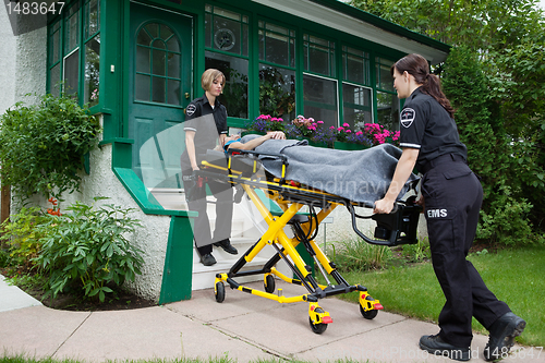 Image of Ambulance Workers with Senior Woman