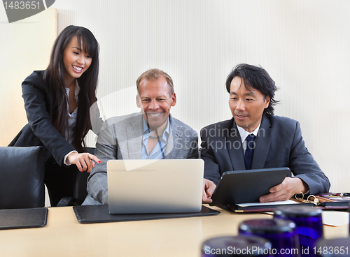 Image of Colleagues working on laptop