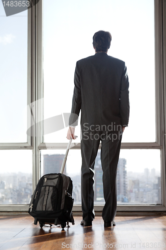 Image of Businessman Holding Luggage
