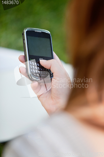 Image of Girl using cell phone