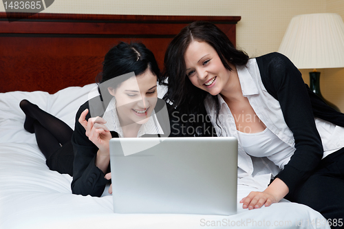 Image of Female Executives Working on Laptop