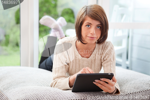 Image of Woman using digital tablet